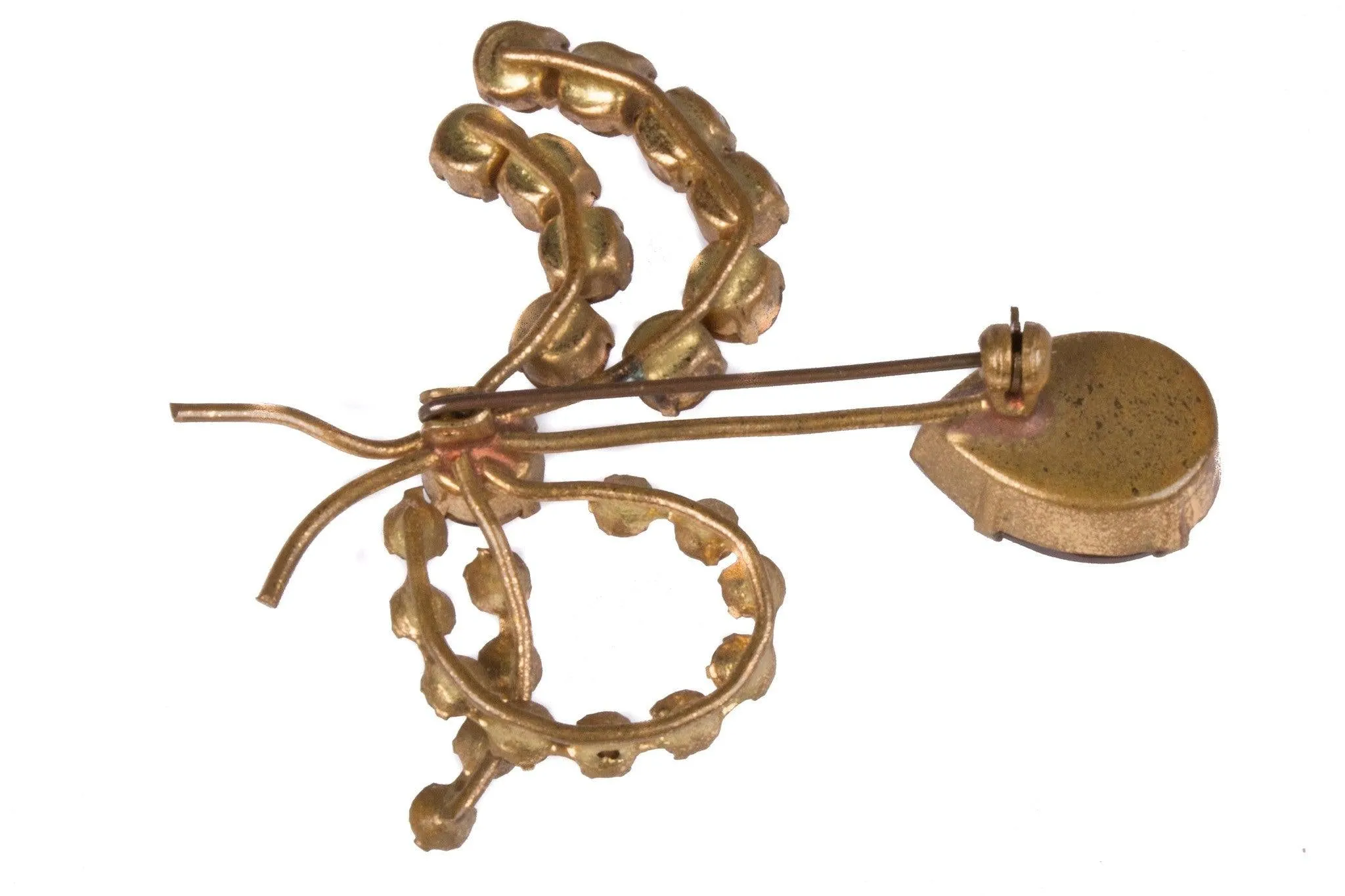 Delicate paste brooch with amber and green stones